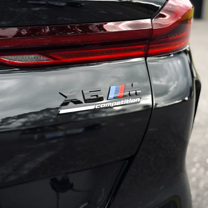 BMW X6 M Competition badge and paintwork after a Signature exterior detail