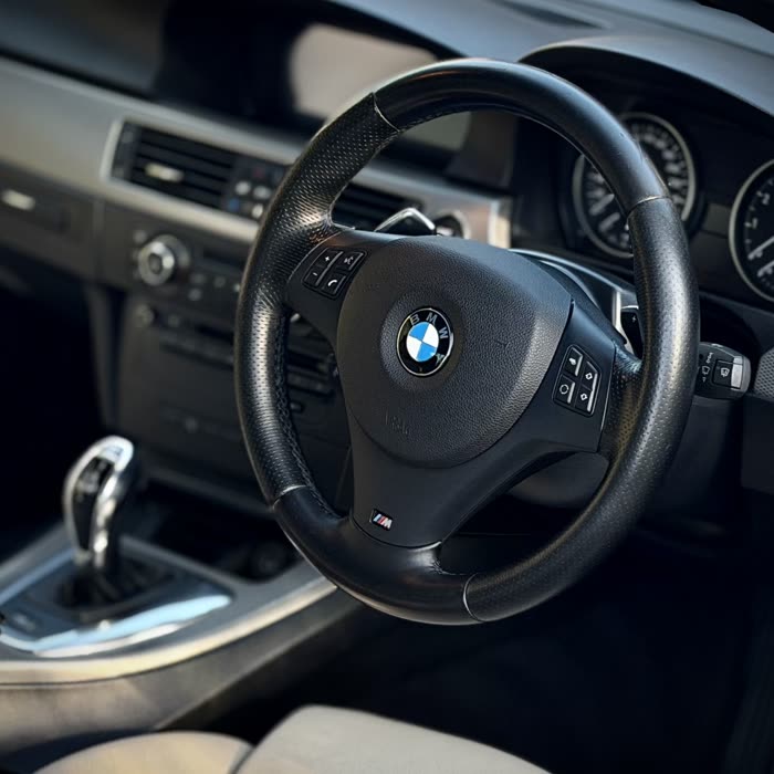 BMW steering wheel, dashboard and console after a Signature interior detail