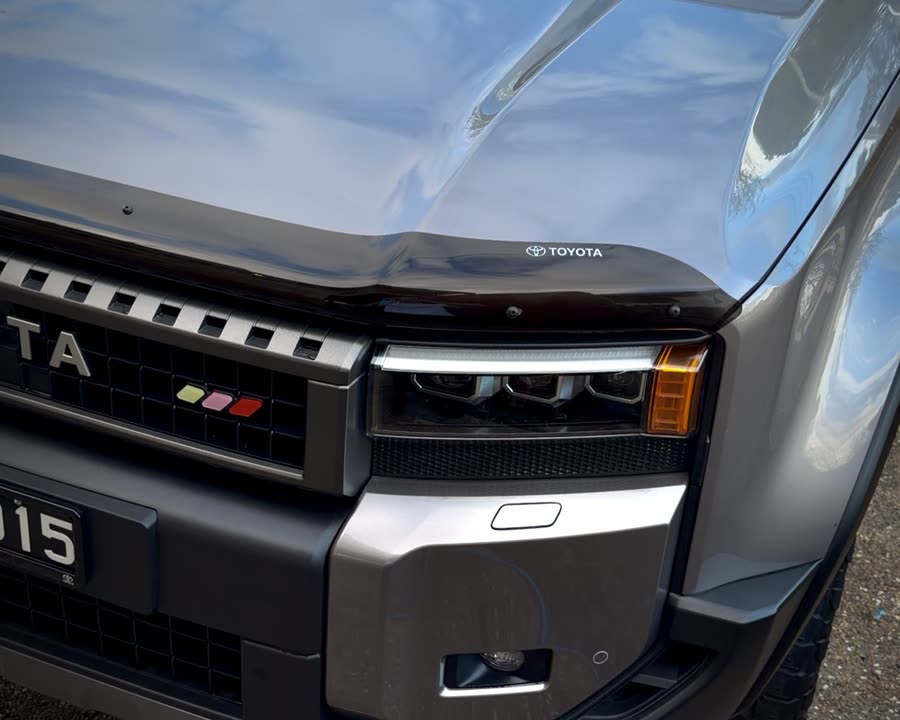 Toyota bonnet and headlight reflecting the sky after an Essential Exterior detail